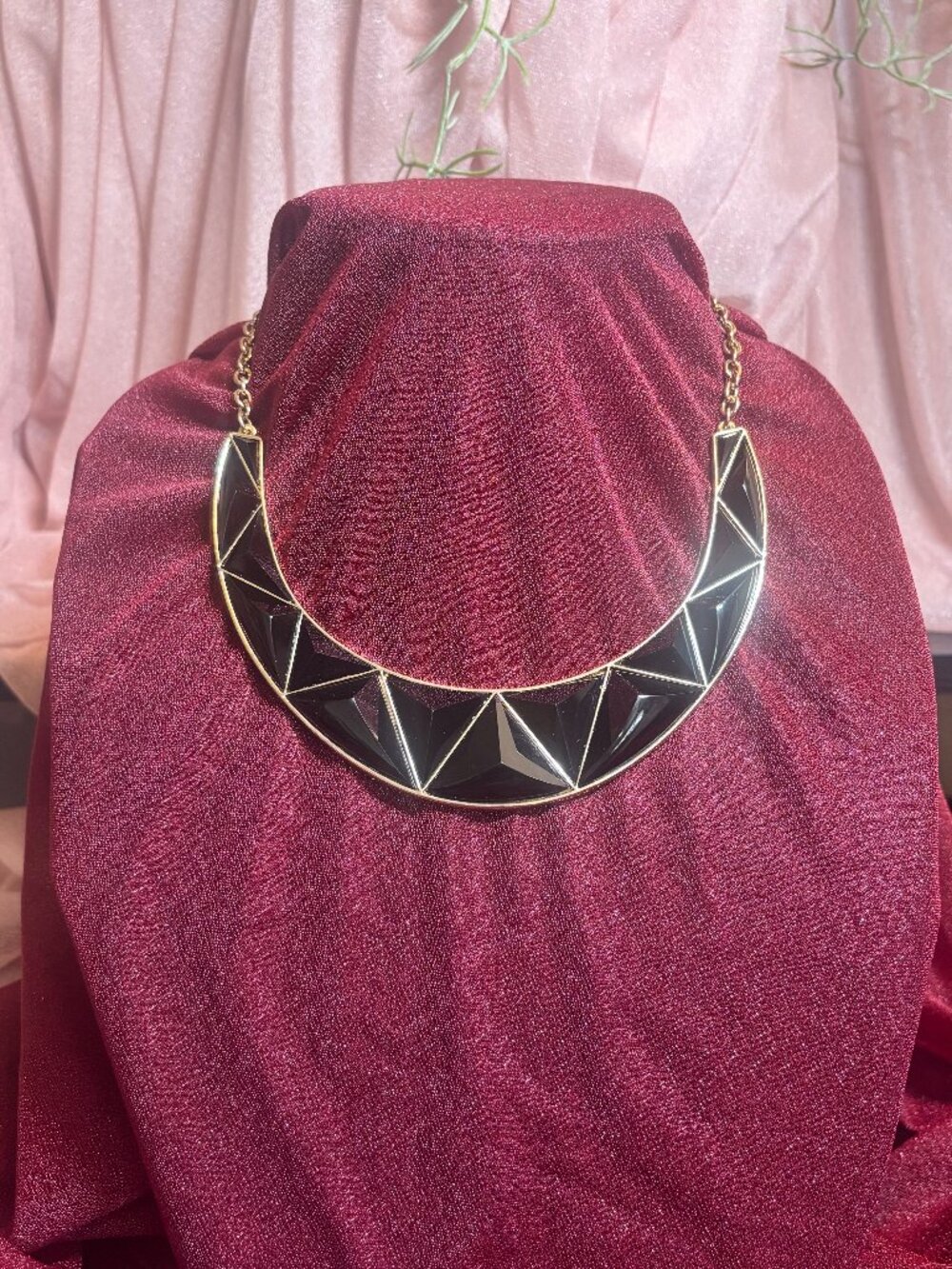 Crescent gold tone Bib necklace with black geometric design